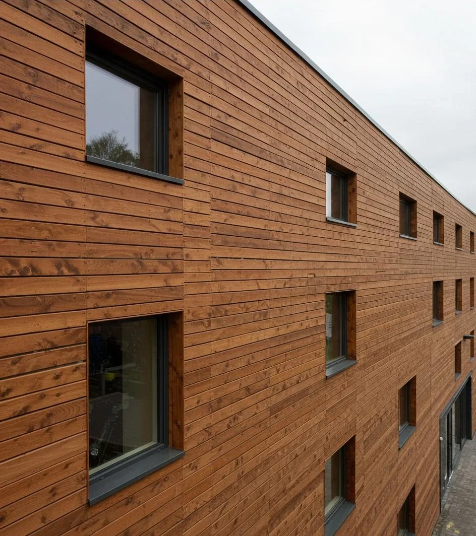 Exterior fibre cement board facade and soffit cladding installed by HG Walls