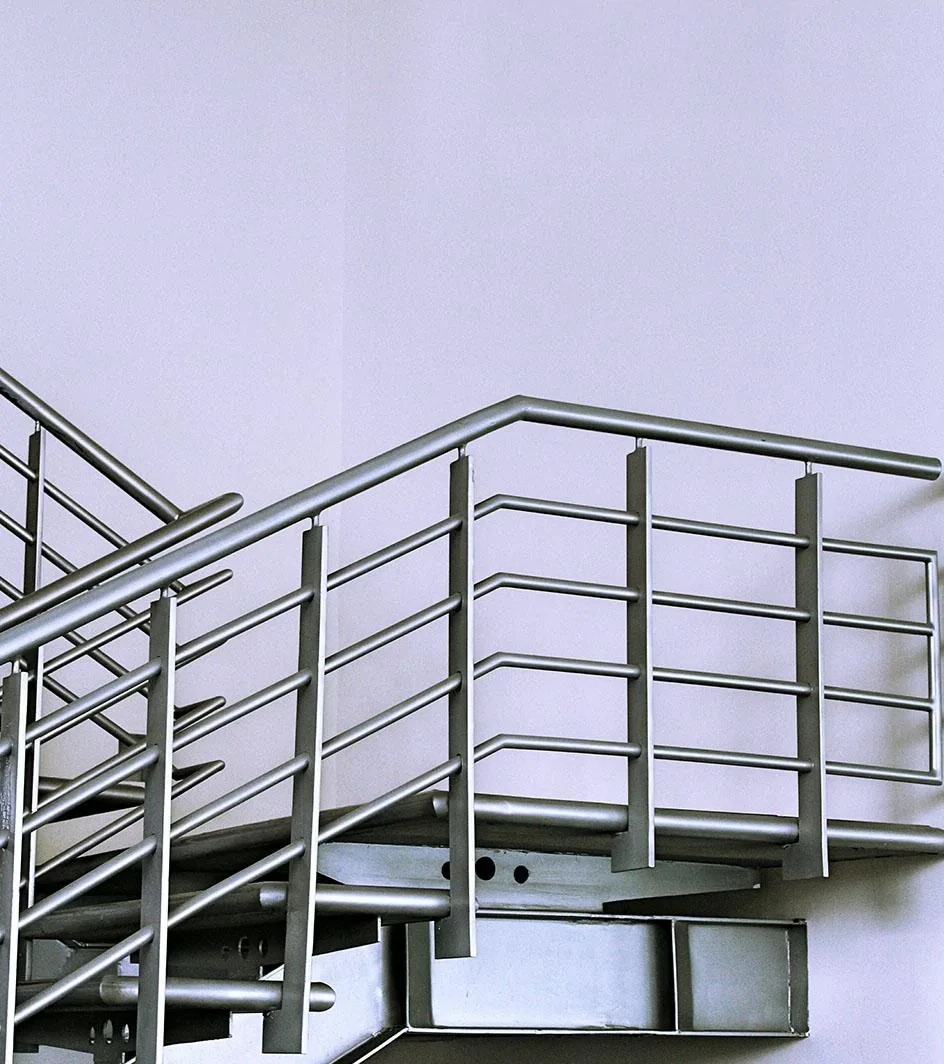 Glass and stainless-steel safety railing installed by HG Walls