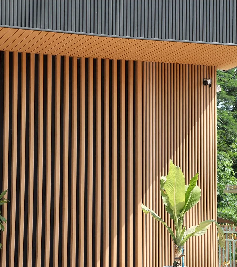 Exterior WPC feature cladding with timber-look profiles installed by HG Walls